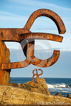 Close-up of two sculptures of the comb of the Wind, at dawn with blue sky, in vertical, in San Sebastian, Basque Country Editorial Stock Photo