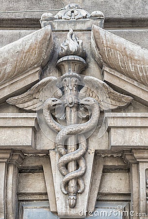 Close-up of two snakes swirled around a winged baton Stock Photo