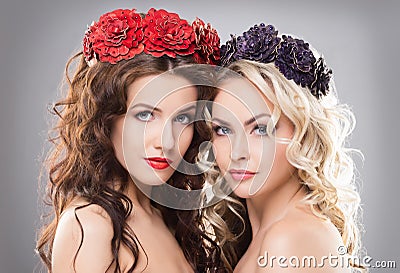 Close-up of two women wearing flower wreathes Stock Photo