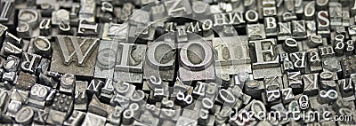 Close up of typeset letters with the word Welcome Stock Photo