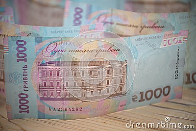 Close up 1000 Ukrainian money hryvnia on white background. Business flat lay with copy space for text. Crisis and problem of Stock Photo