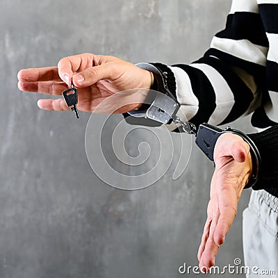 Close-up of unidentified hands of prisoner in prison stripped un Stock Photo