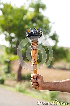 Close up of unrecognizable athlete Hands holding Sports flame torch Stock Photo