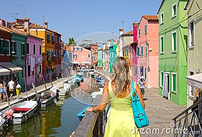 CLOSE UP: Unrecognizable woman looking at the picturesque streets of Venice. Editorial Stock Photo