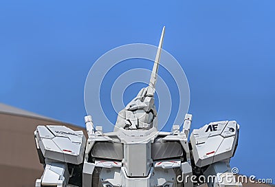 Close up on the upper body of giant robot statue RX-0 Unicorn Gundam at DiverCity Tokyo Plaza in Odaiba. Editorial Stock Photo