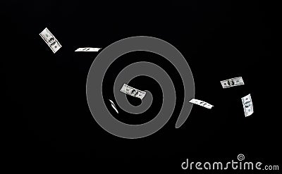 Close up of us dollar money flying over black Stock Photo