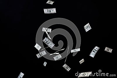 Close up of us dollar money flying over black Stock Photo