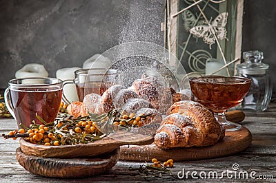 Close up. Valentine`s Day. Romantic breakfast with freshly baked french croissants, powdered on top white sugar powder Stock Photo