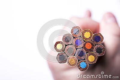 Close up of various color pencils in hand Stock Photo