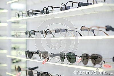 Close up of various glasses lying on the shelves in optical store Stock Photo