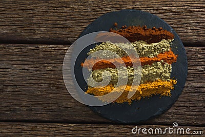 Various type of spice powder on a chopping board Stock Photo