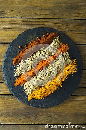 Various type of spice powder on slate plate Stock Photo