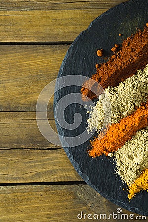 Various type of spice powder on slate plate Stock Photo