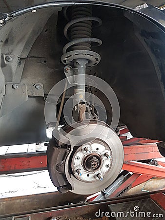 Close-up vehicle axle inspection, disc brake Stock Photo