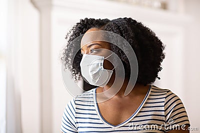 Close up view of an African American woman wearing a face mask Stock Photo