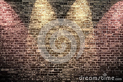 Close up view at an aged brick wall with some bright colored spot lights Stock Photo