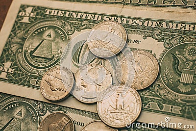 Close up view of American dollar bills and coins as background. Heap of American dollars for design. Stock Photo