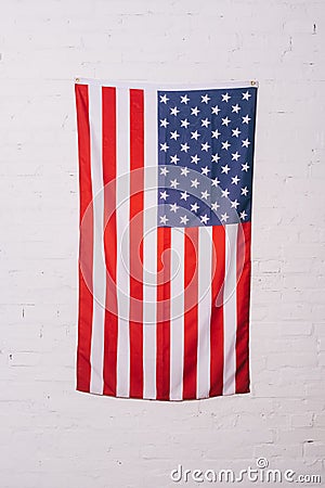 close up view of american flag hanging on white Stock Photo