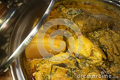 A close up view of assorted meat in a pot of Nigerian soup Stock Photo