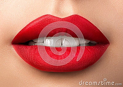 Close up view of beautiful woman lips with red matt lipstick Stock Photo