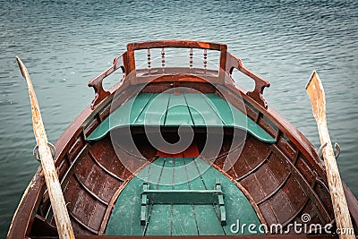 Close up view on beautiful wooden flat rowing boat with oars on lake bled, slovenia, go green concept Stock Photo