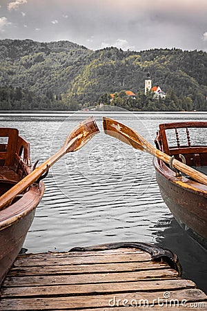 Close up view on beautiful wooden flat rowing boats with oars on lake bled, slovenia, go green concept Stock Photo