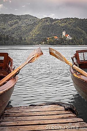 Close up view on beautiful wooden flat rowing boats with oars on lake bled, slovenia, go green concept Stock Photo