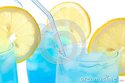 Close up view of blue lagoon cocktails with ice cubes on white Stock Photo