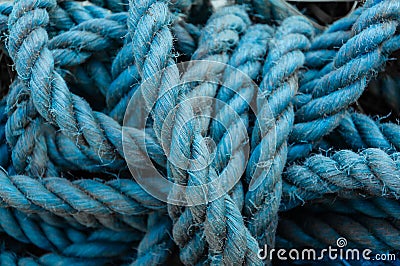 Close up view of blue ropes and nylon nets used to fish. Stock Photo