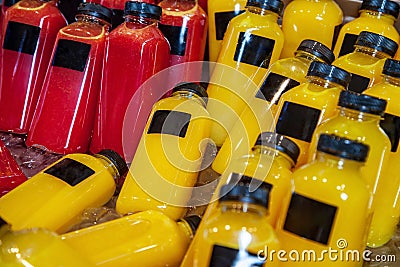 close up view of bottles of fresh juices in refrigerator Stock Photo