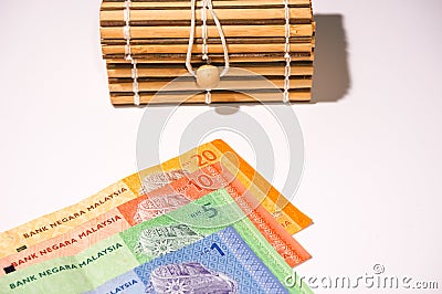 Brown gift box on malaysia notes Stock Photo