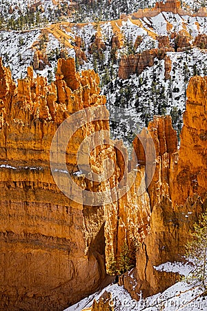 Close up view of bryce canyon national park hoodoos in winter in souther utah usa showing oranges and whites during the day Stock Photo