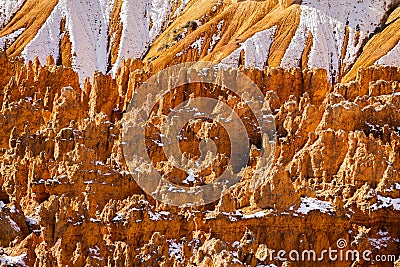 Close up view of bryce canyon national park hoodoos in winter in souther utah usa showing oranges and whites during the day Stock Photo