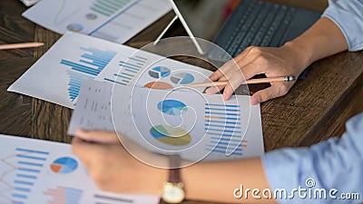 Close up view of businessman focusing on his work with business charts Stock Photo