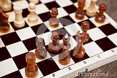 Close up view chess pieces on wooden board Stock Photo