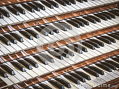 Close up view of a church pipe organ with four keyboards Stock Photo