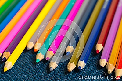 Close up view of crayons. Colored Pencils. Colored pencils on wooden background. Stock Photo