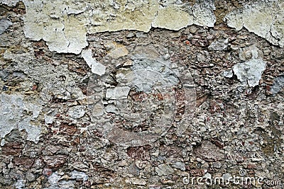 Close up view of crumbling plaster brick wall Stock Photo