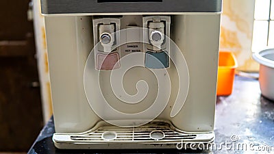 Close up view of the dirty water filter and purifier at the kitchen of a house. Dirt and dust on the platform Stock Photo