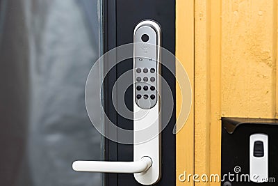 Close up view of an electric combination lock on a black door. Interior design. Stock Photo