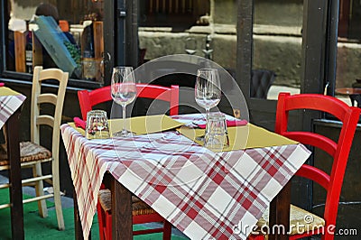 Close up view of empty quaint little restaurant with tables set on the sidewalk Stock Photo