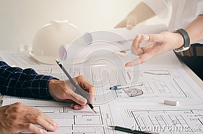 Close-up view of the engineers` plans being discussed. with architect equipment architect on desk Successful teamwork Stock Photo