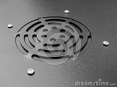 Close-up view of the exhaust port and guard seen on top of an IT rack enclosure. Stock Photo