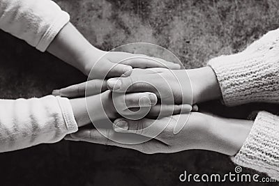 Close up view of family holding hands, loving caring mother supporting child. Helping hand and hope concept Stock Photo