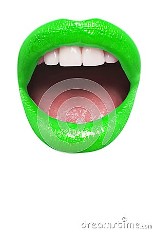 Close-up view of female wearing neon green lipstick with mouth open over white background Stock Photo