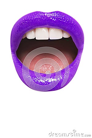 Close-up view of female wearing purple lipstick with mouth open over white background Stock Photo