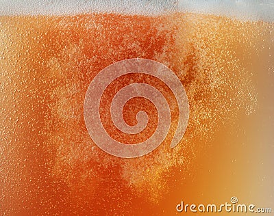 Close up view of floating bubbles in unfiltered beer texture Stock Photo