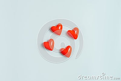 Close up view of four hearts on a gray background. Stock Photo
