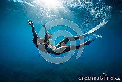 Close up view of freediver woman with fins in underwater. Freediving with girl Stock Photo