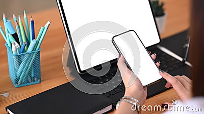 Close up view graphic designer woman working with tablet computer and using mobile phone. Stock Photo